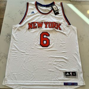 Adidas NY Knicks Autographed Porzingis Jersey.
